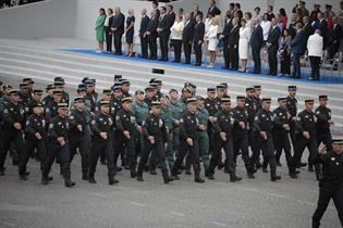 Members of the Civil Guard parading alongside the French gendarmerie