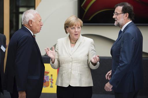 José Manuel García -Margallo, Angela Merkel, Mariano Rajoy