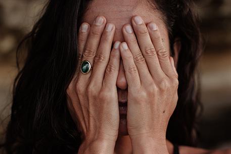 15/01/2020. Woman covering her face. Woman covering her face