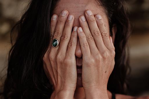 15/01/2020. Woman covering her face. Woman covering her face